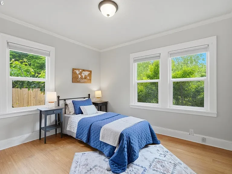 Bedroom with blue bedding and writing desk