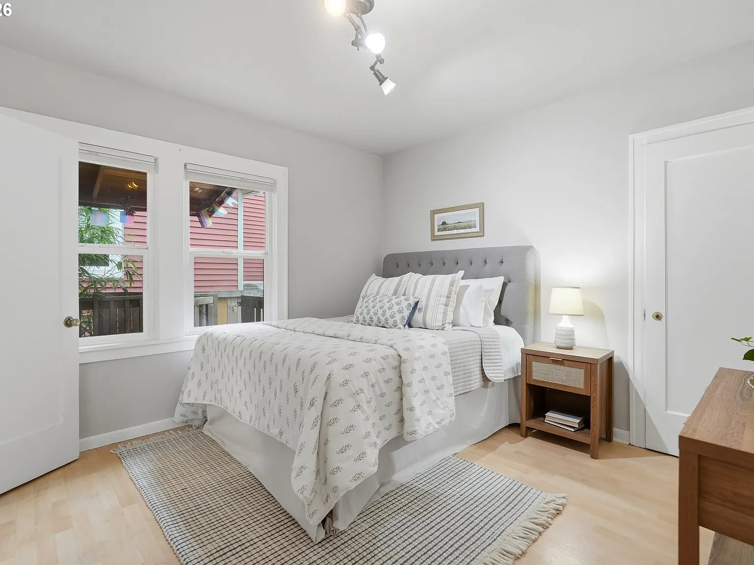 Bedroom with layered white bedding