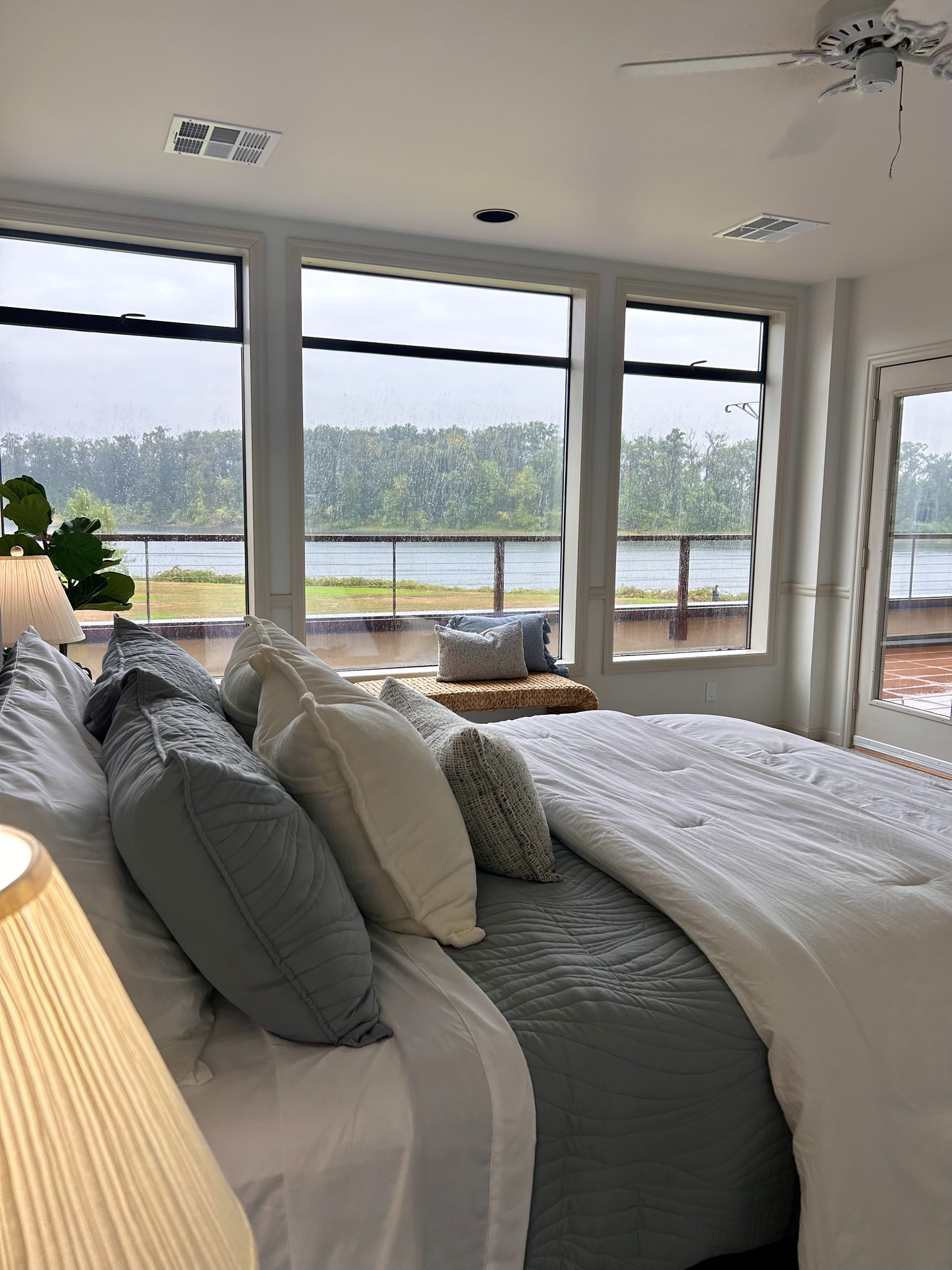 Bedroom looking toward the river and balcony