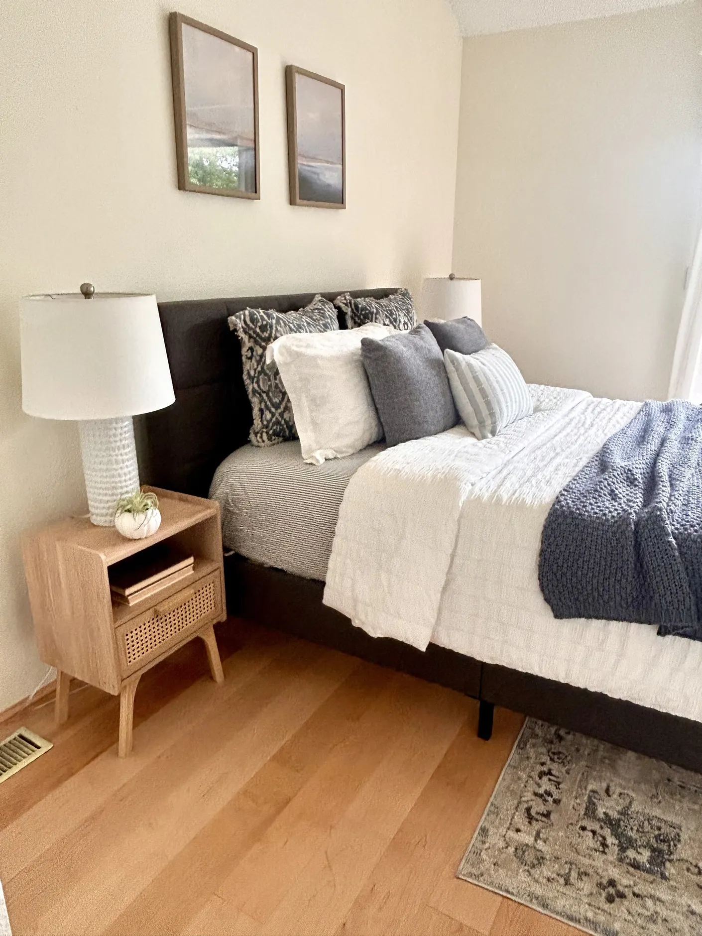 Bedroom with layered blue and white bedding