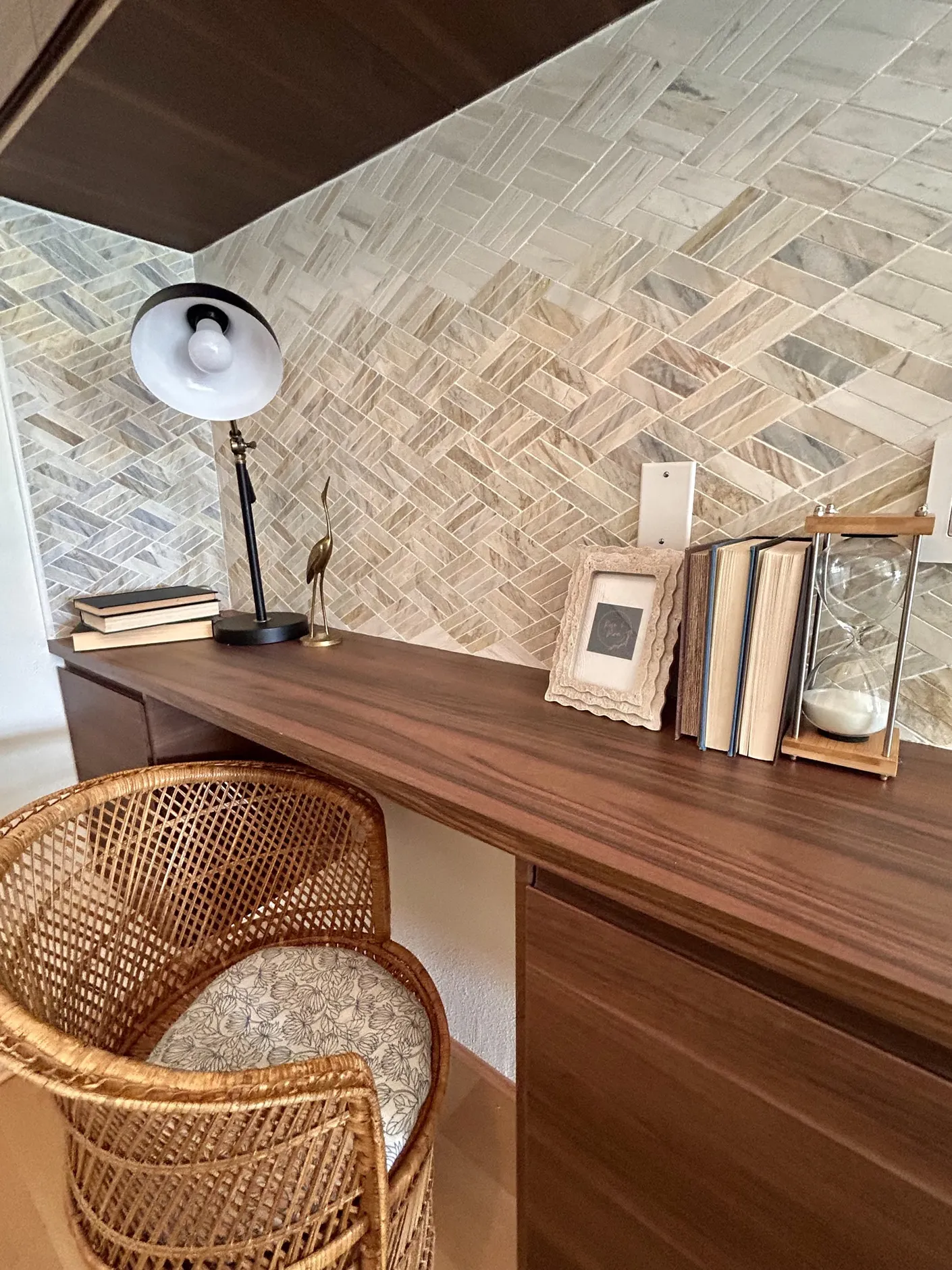 Home office with wood desk and woven chair