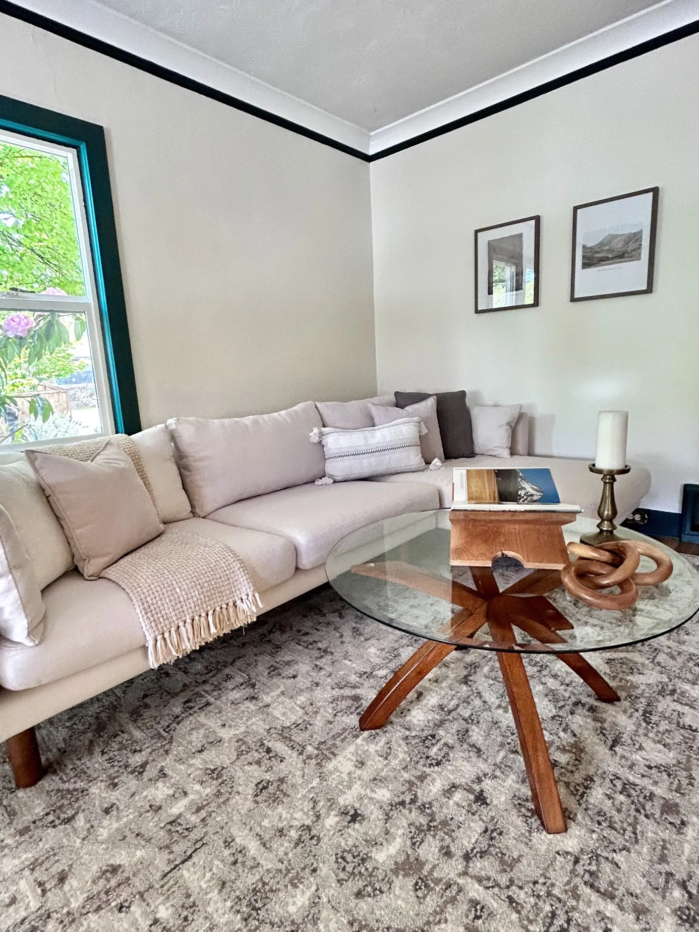 Staged living room with pale sofa and glass coffee table