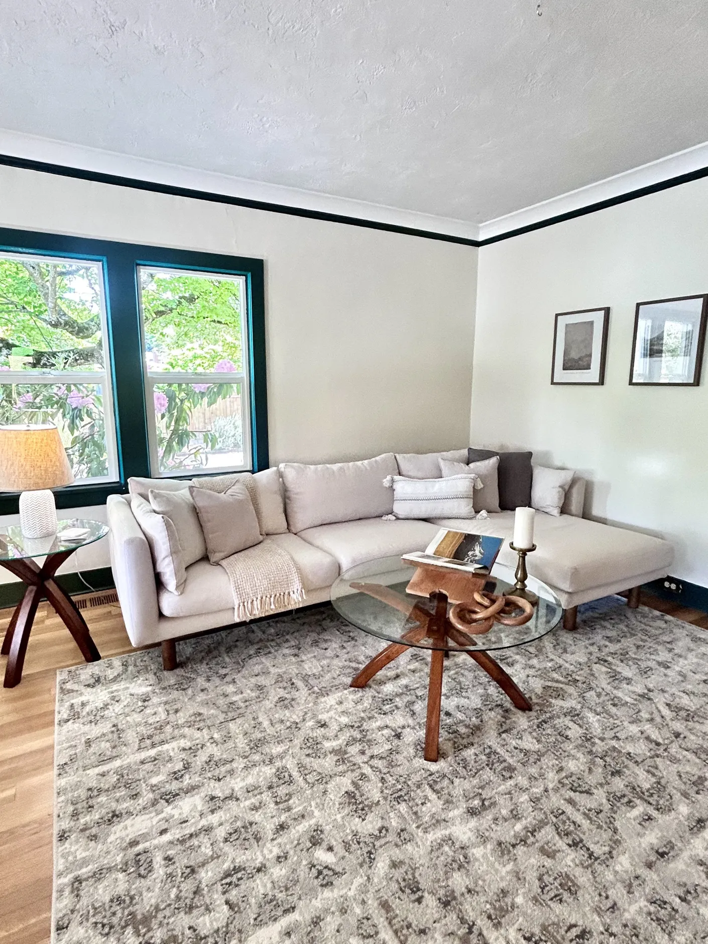 Wide view of the staged living room and corner sofa