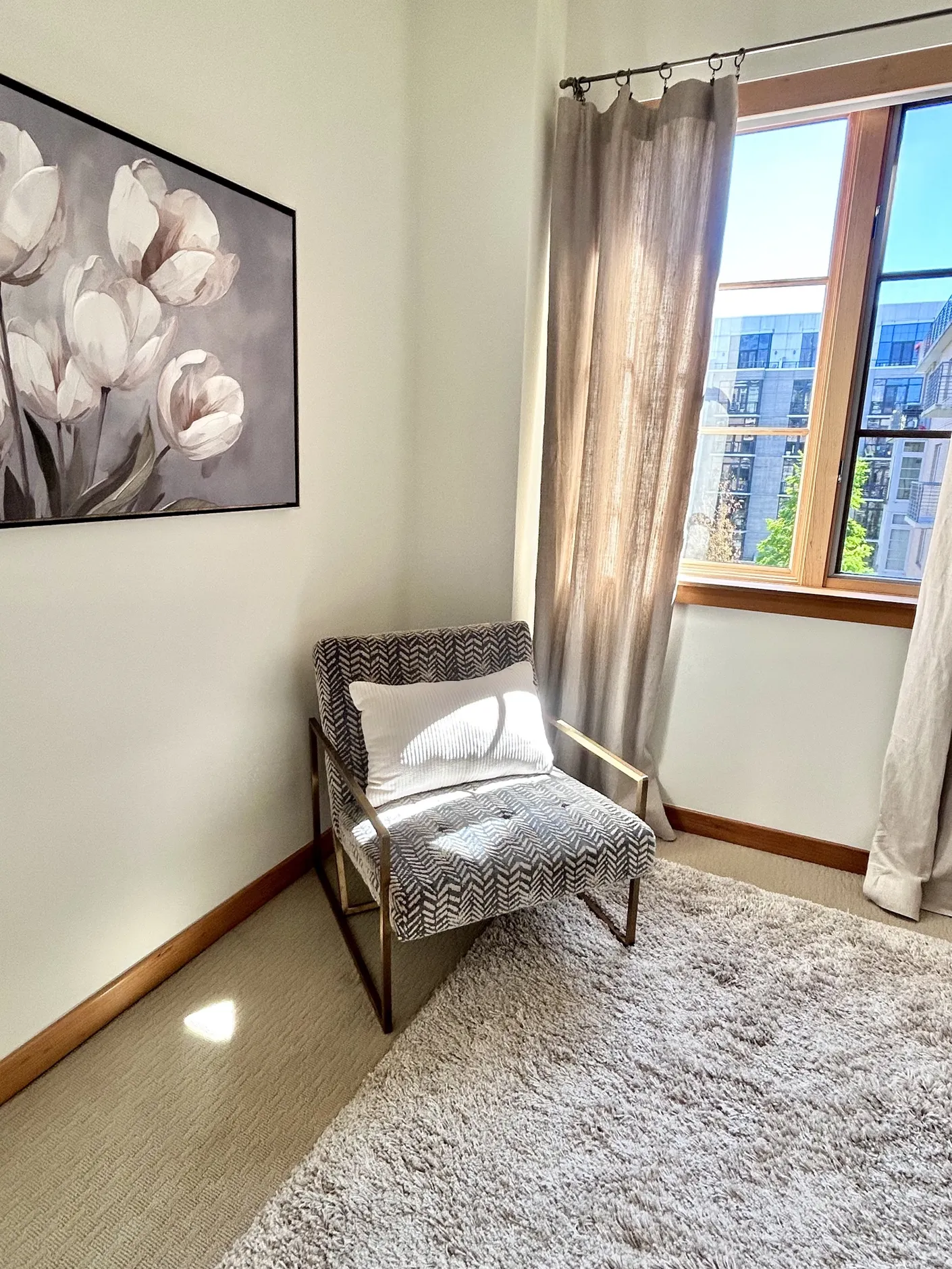 Upholstered chair by the bedroom window