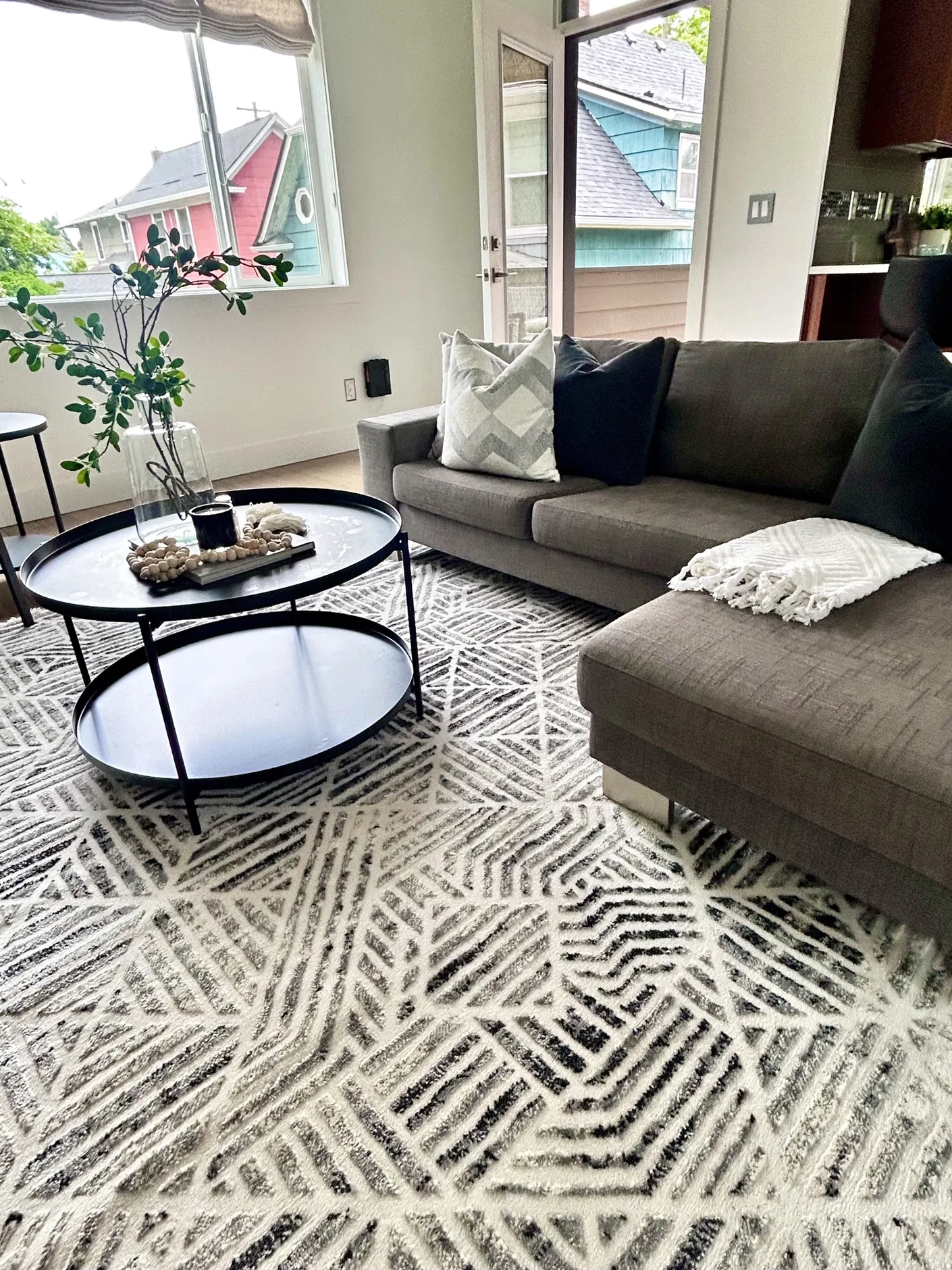 Gray sectional and round coffee table in the living room