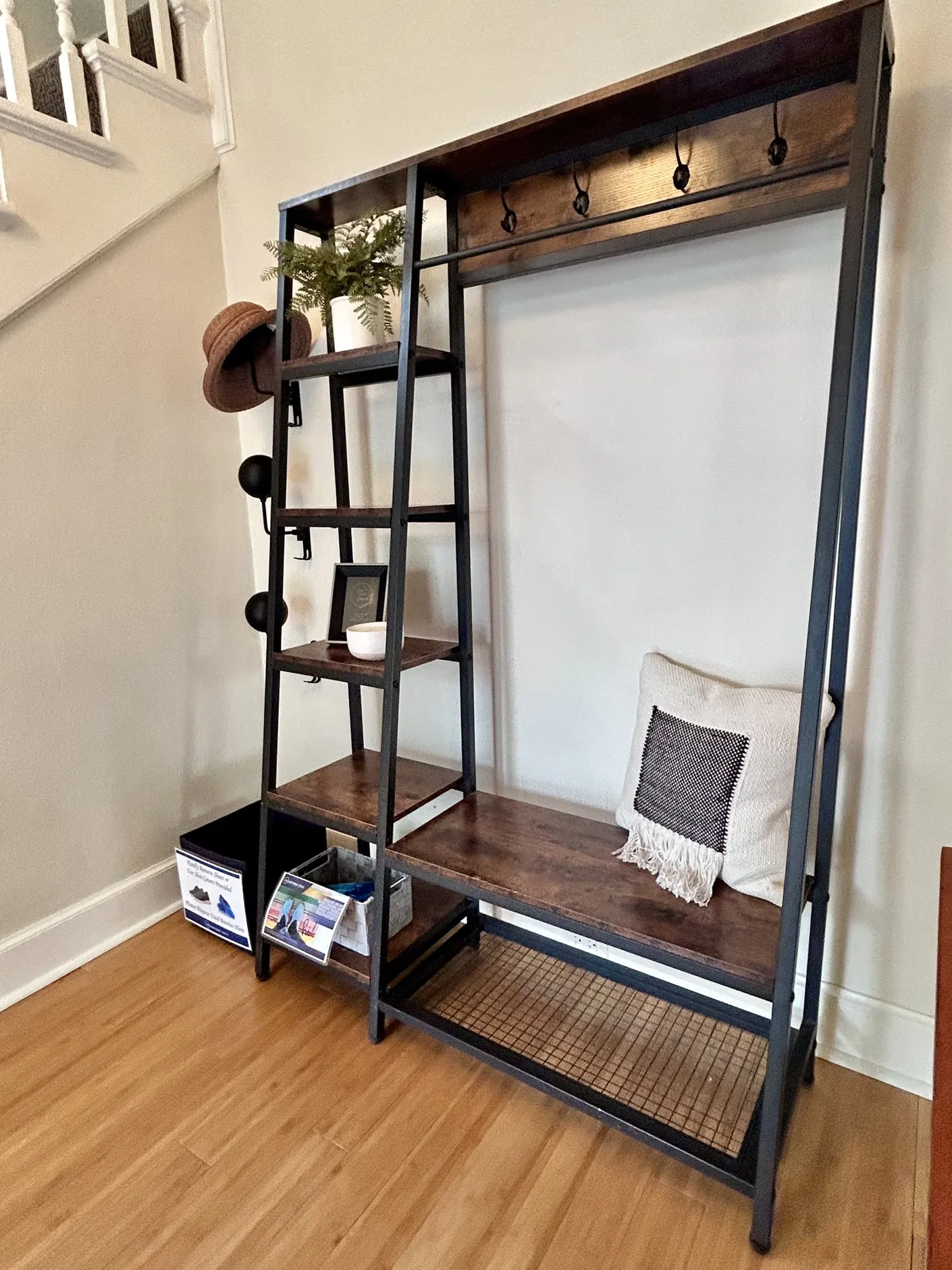 Entry bench with hooks and open shelves