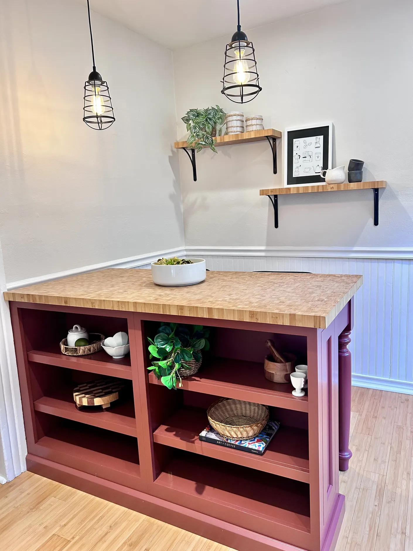 Styled kitchen island beneath pendant lights