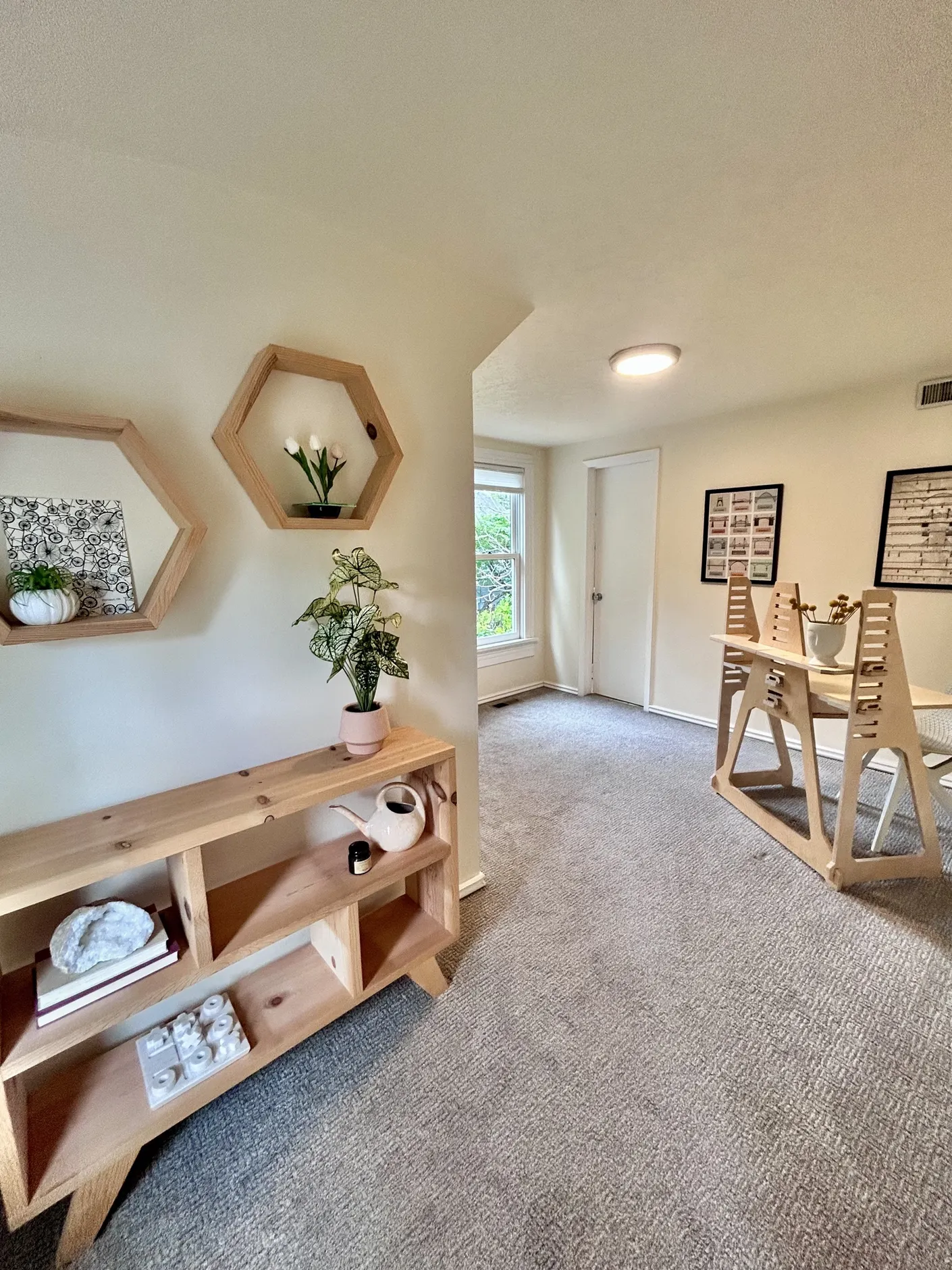 Playroom with wood shelving and children’s table