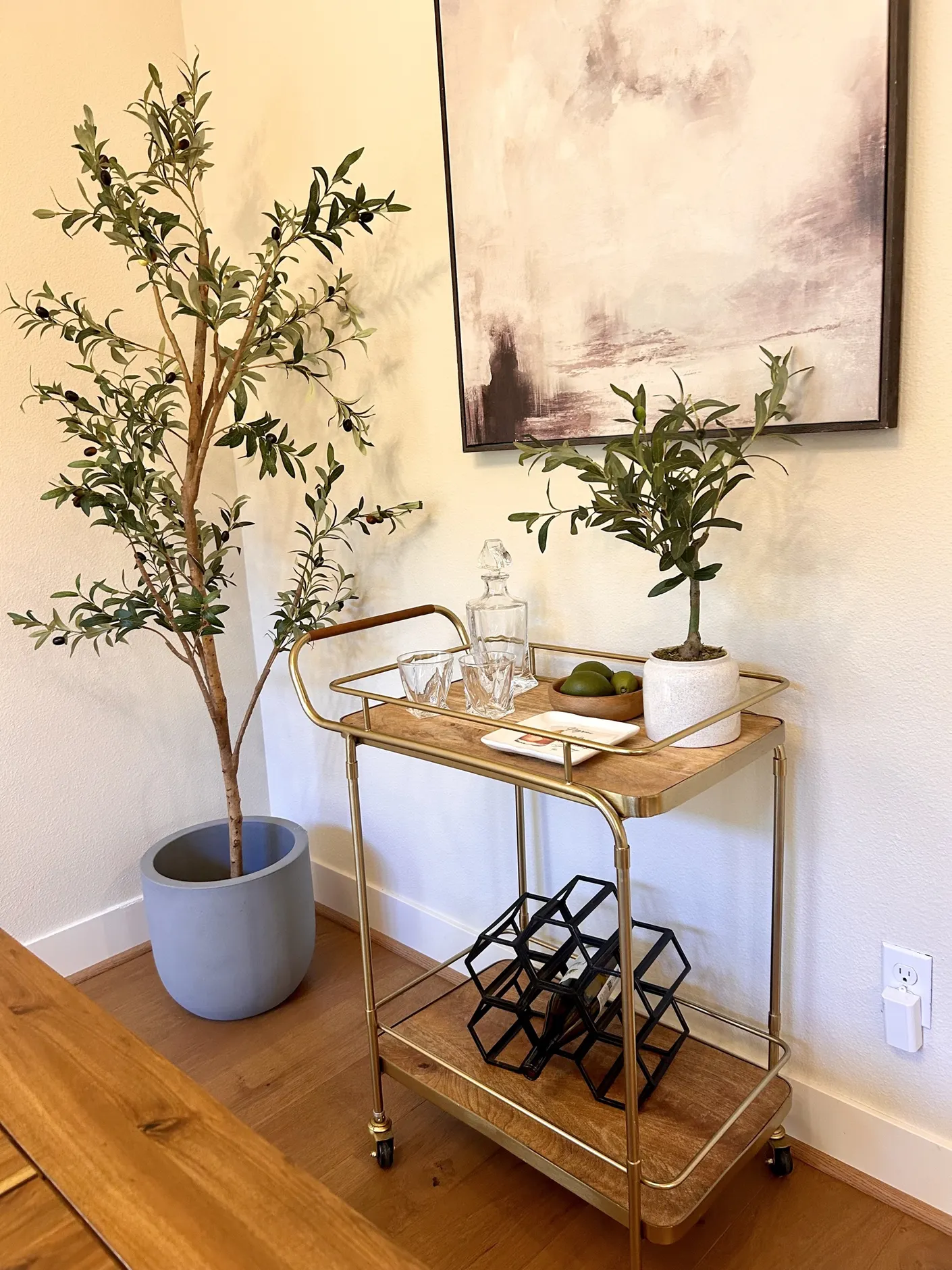 Bar cart with greenery and glassware