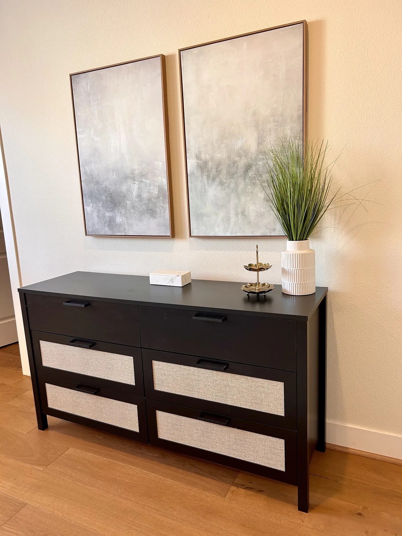 Dresser beneath abstract artwork