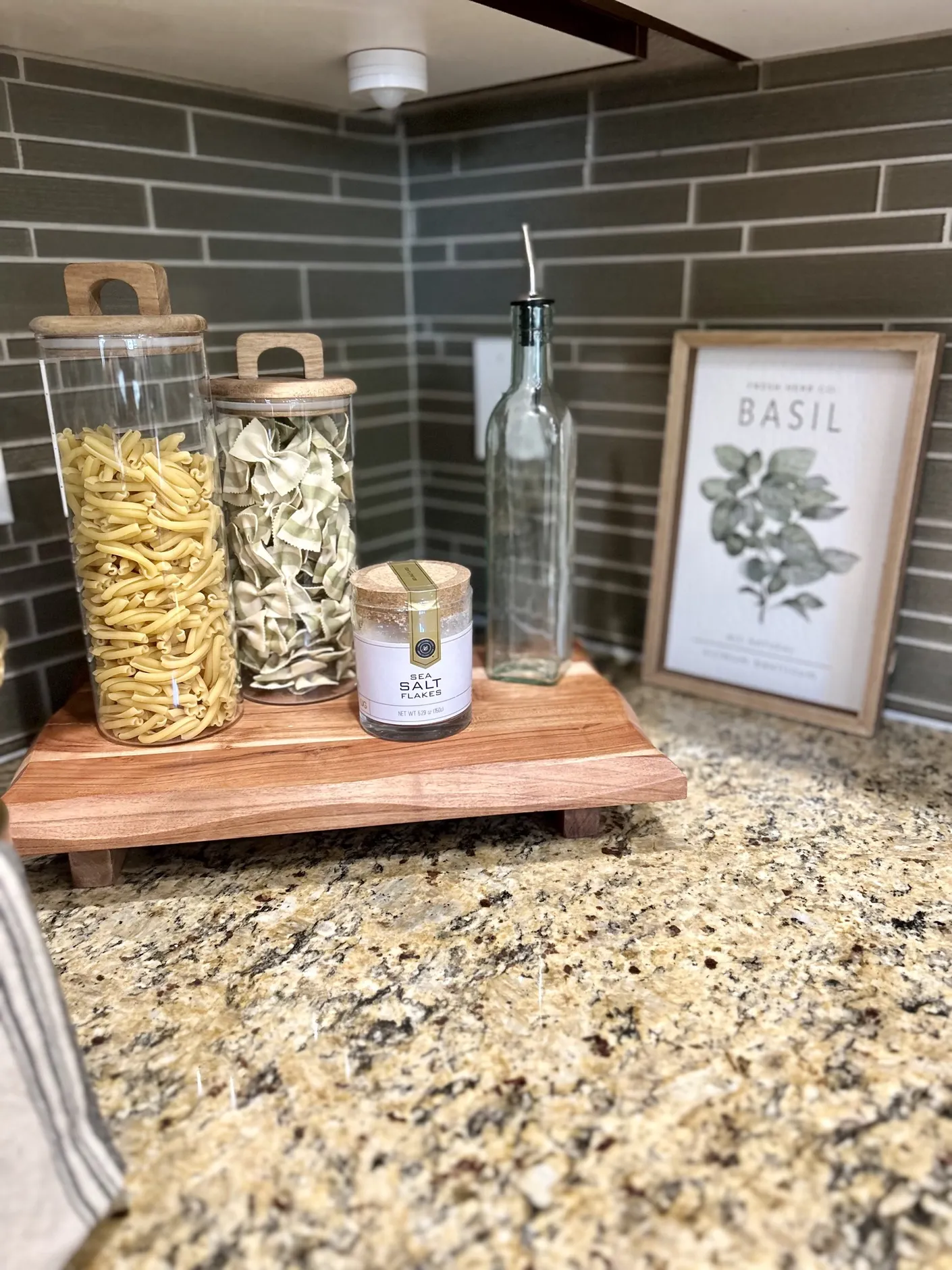Pasta jars and basil artwork in the kitchen